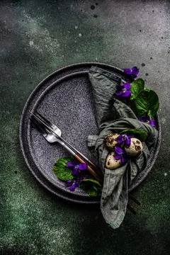 Spring table setting with viola flower Stock Photos