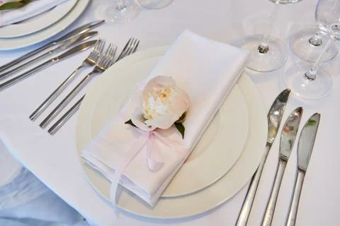 Spring table settings with fresh flower, napkin and silverware. Holidays Stock-Fotos