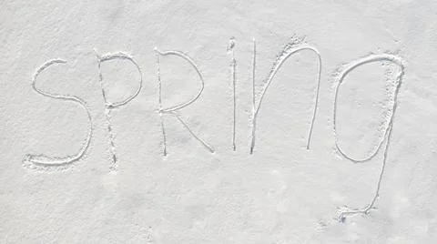 Spring text written on virgin snow Foto stock