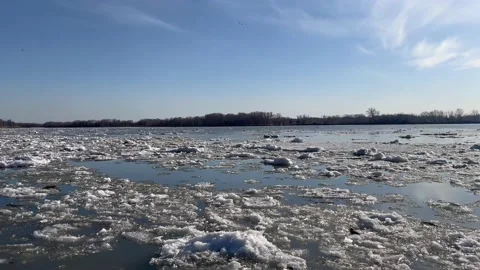Spring Thaw: Melting Ice and Flying Birds Stock Footage 238375866