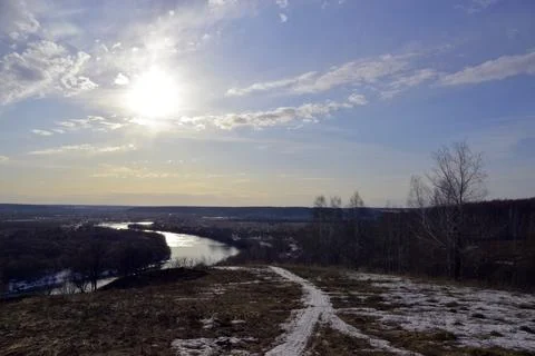 Spring thawed patches in the fields, the Sylva river is slowly freed from ice Stock Photos