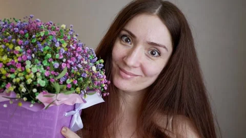 Spring time, congratulations on Women's Day. Beautiful woman with a creative flo Stock Footage 266041571