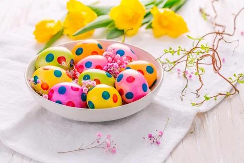 Spring time   Easter eggs and tulips on white background Stock Photos
