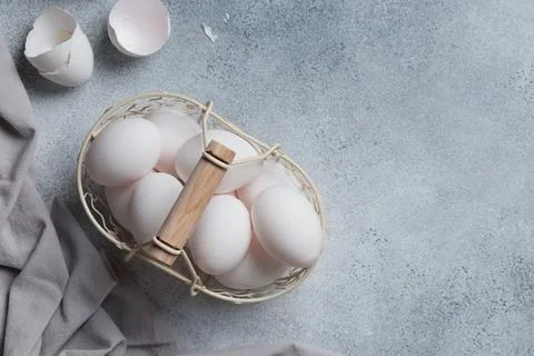 Spring time, easter holidays, white eggs in a basket Stock Photos