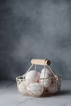 Spring time, easter holidays, white eggs in a basket Fotos de archivo