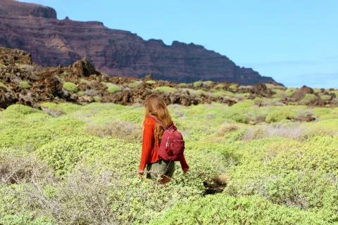 Spring time hike. Back view of girl exploring the northern of the island of L Fotos Stock
