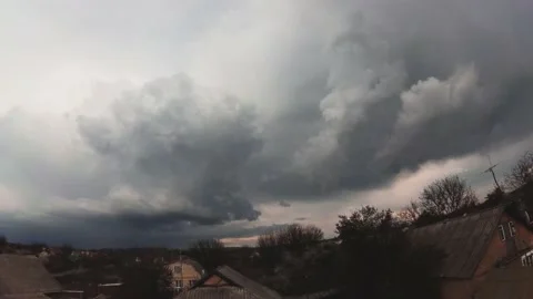 Spring timelapse thunderclouds in the village Stock Footage 131734248