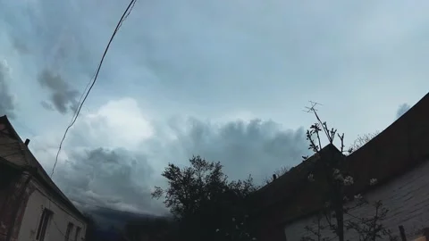 Spring timelapse thunderclouds in the village Stockbeeldmateriaal 131734484