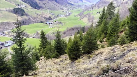 Spring top view to austrian cozy valley village in cloudy day. green meadows, Stock Footage 306583468