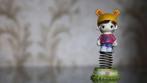 Spring toys happily swinging back and forth Stock Footage 112855946