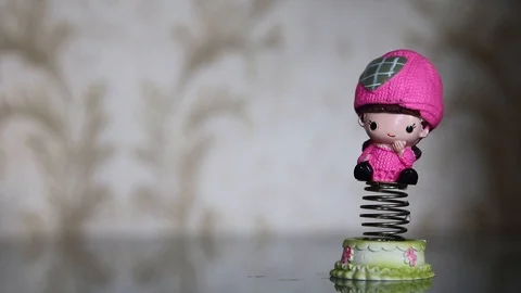 Spring toys happily swinging back and forth Stock Footage 112855948