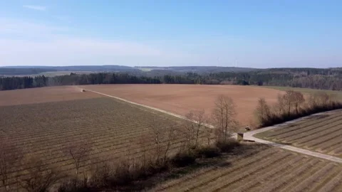 Spring, tractor plows the field Stock Footage 172057496