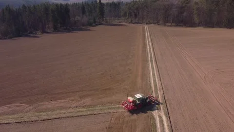 Spring, tractor plows the field Stock Footage 172057626