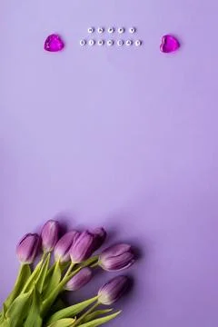 Spring tulip and text happy birhday on english laid out of multi-colored cube on Stock Photos