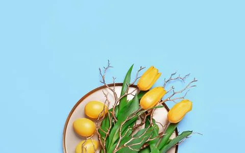 Spring tulips and Easter eggs on golden tray Stock Photos