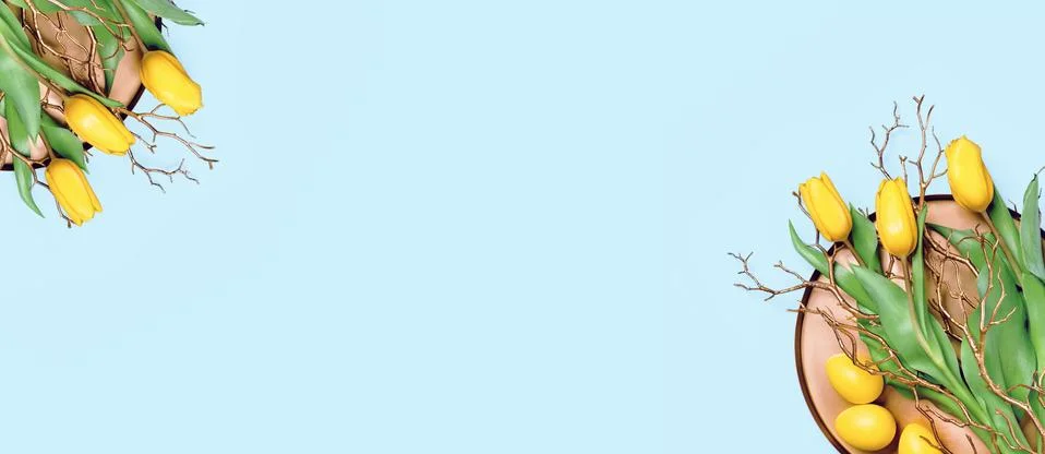 Spring tulips and Easter eggs on golden tray Stock Photos