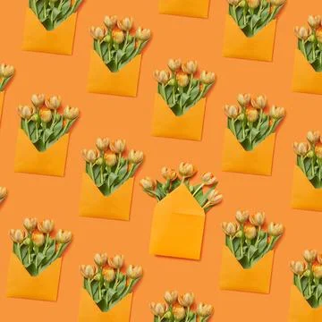 Spring tulips flowers pattern on a yellow background. Handmade envelopes w... Stock Photos