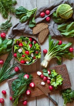 Spring vegetable diet salad with radish, cucmber, savoy and greens Stock Photos