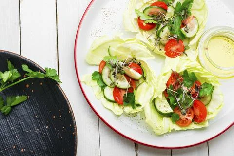 Spring vegetable salad on plate Stock Photos