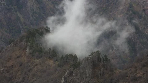 In spring the veil of mist creeping up the mountain slopes of the Caucasus Vídeo Stock 63222017