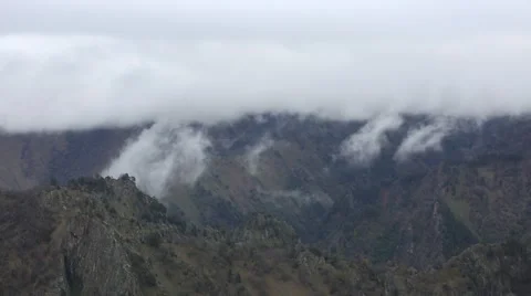 In spring the veil of mist creeping up the mountain slopes of the Caucasus Vídeo Stock 63222123