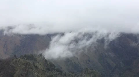 In spring the veil of mist creeping up the mountain slopes of the Caucasus Vídeo Stock 63222170