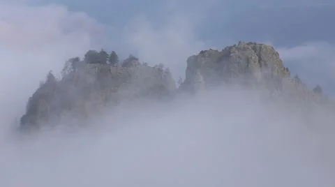 In spring the veil of mist creeping up the mountain slopes of the Caucasus Vídeo Stock 63222196