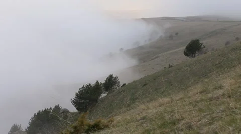 In spring the veil of mist creeping up the mountain slopes of the Caucasus Видео 63222364
