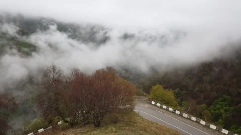 In spring the veil of mist creeping up the mountain slopes of the Caucasus Stock Footage 63222552