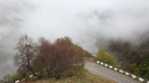 In spring the veil of mist creeping up the mountain slopes of the Caucasus Vídeos de archivo 63222638