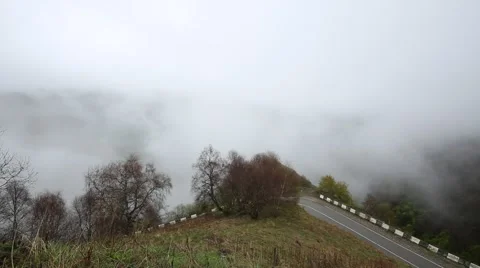 In spring the veil of mist creeping up the mountain slopes of the Caucasus Vídeo Stock 63222701