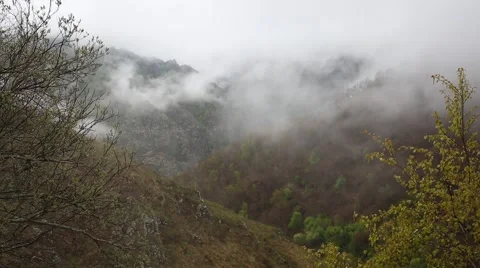 In spring the veil of mist creeping up the mountain slopes of the Caucasus Vídeo Stock 63222769
