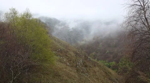 In spring the veil of mist creeping up the mountain slopes of the Caucasus Видео 63222896