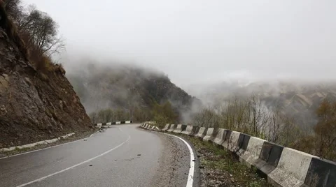 In spring the veil of mist creeping up the mountain slopes of the Caucasus Vídeo Stock 63223045