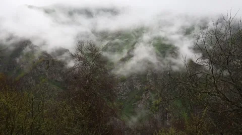 In spring the veil of mist creeping up the mountain slopes of the Caucasus 스톡 동영상 63223116