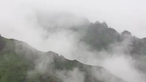 In spring the veil of mist creeping up the mountain slopes of the Caucasus 動画素材 63223723