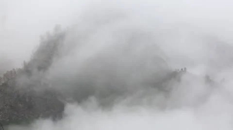 In spring the veil of mist creeping up the mountain slopes of the Caucasus Stock Footage 63224016