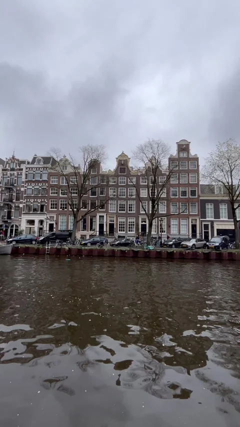 Spring View of Amsterdam Streets, Canals, and Bicycles with Traditional Houses Video stock 312007443