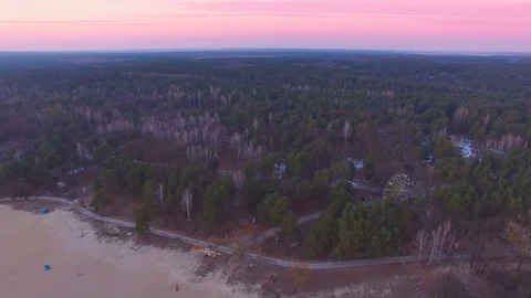 Spring view of coast and forest and ferris wheel Stock Footage 73799852