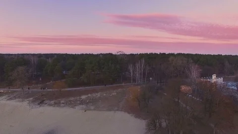 Spring view of coast and forest and ferris wheel Stock Footage 73801619