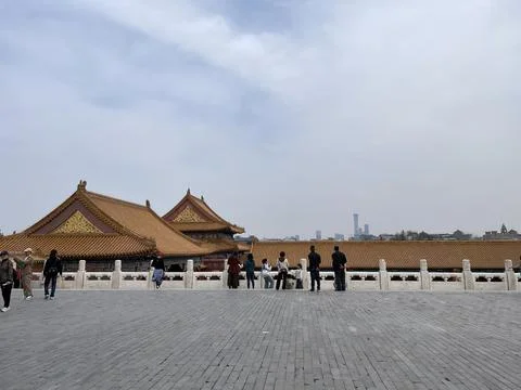 Spring View of the Forbidden City with Rooftops and Distant Modern Buildings Stock Photos