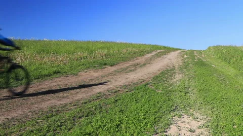 Spring walk by bicycle on a dirt road Stock Footage 62072482