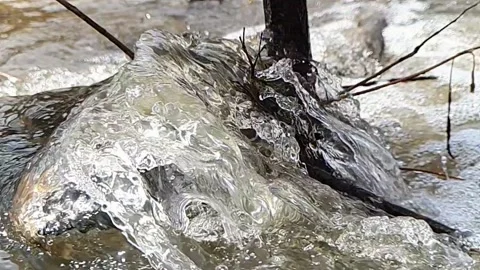 Spring water flood in slow motion Stock Footage 158906635