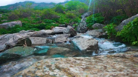 Spring water in the mountains Stock-Footage 243965583