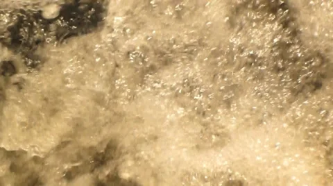 Spring water splashes and ripples as it cascades across rocks Stock Footage 38354264