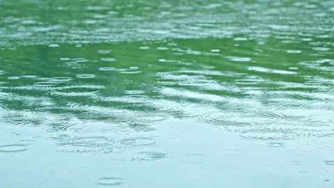 Spring water surface lake - raindrops close-up Stock Footage 257858951