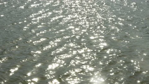Spring water surface lake sparkling slow flow Video stock 233683497