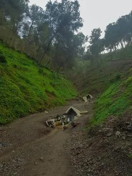 A spring of water at the top of the mountain between the valley Stock Photos