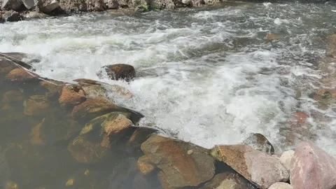 Spring waterfall between stones Video stock 320949548