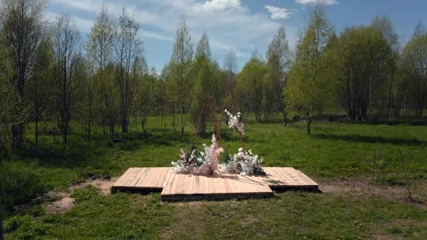 Spring Wedding Arch in Lush Green Field, Nature Elegance. Aerial Drone shot. Stock Footage 257770098